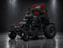 MowTech Reaper X36 commercial lawn mower in black with red handlebars and front caster wheels, front three-quarter view